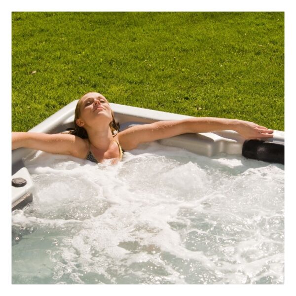 woman relaxing in an outdoor spa