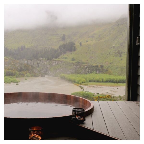 Circular hot tub with scenic mountain view