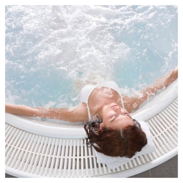 Woman relaxing in a jacuzzi, eyes closed