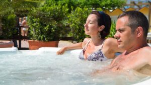 man and woman relaxing in hot tub