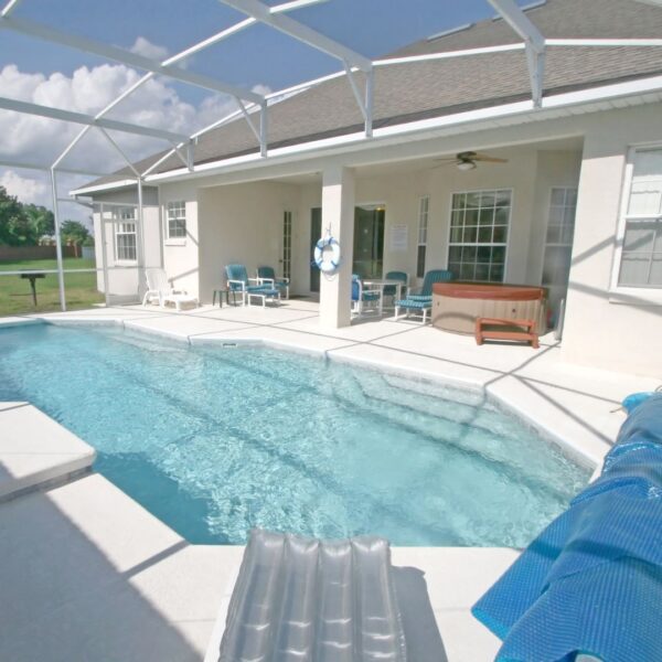 hot tub on back patio near pool
