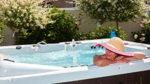 Woman wearing a hat in a hot tub