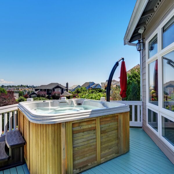 hot tub on deck of house overlooking neighborhood
